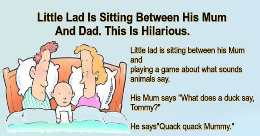Little Lad Is Sitting Between His Mum And Dad.